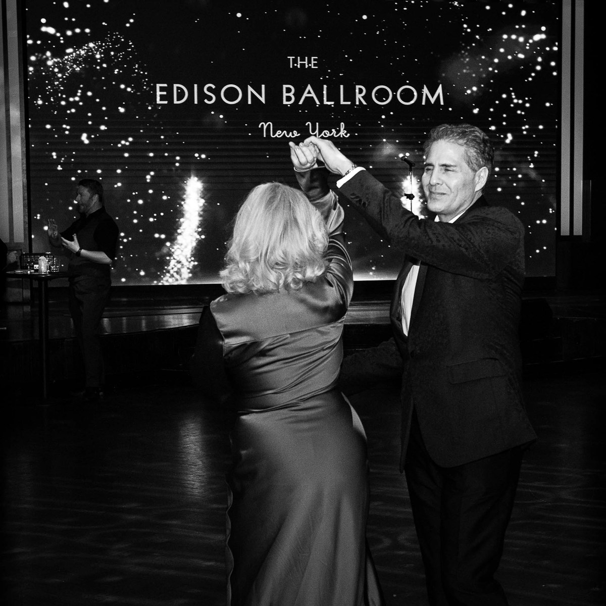 A couple dancing beneath the Edison Ballroom logo