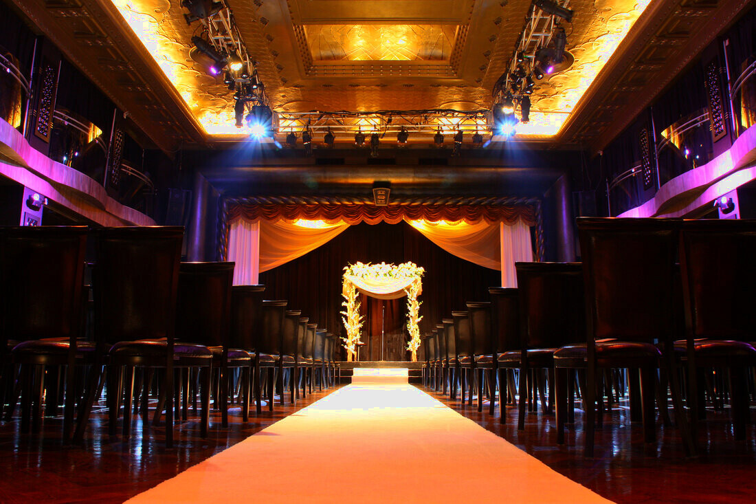 Candlelit wedding ceremony aisle in golden light